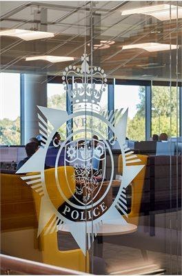 Cleveland Police badge on glass.