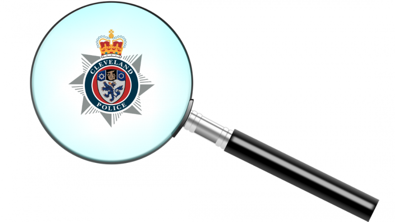Magnifying glass with Cleveland Police logo in the centre