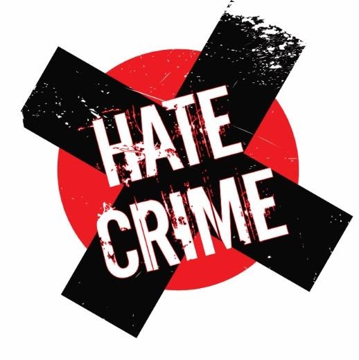 hate crime logo, with a black cross on a red circle. 