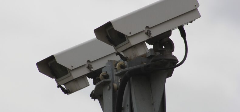 Two CCTV cameras pointing downwards