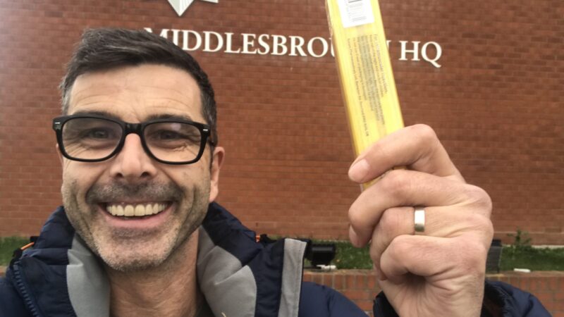 George Charlton is holding up a lifesaving Naloxoner kit outside Middlesbrough Police Station
