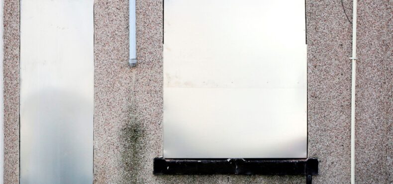 A property with metal screens at the window and door